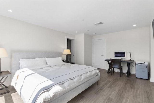 bedroom featuring recessed lighting, visible vents, and wood finished floors
