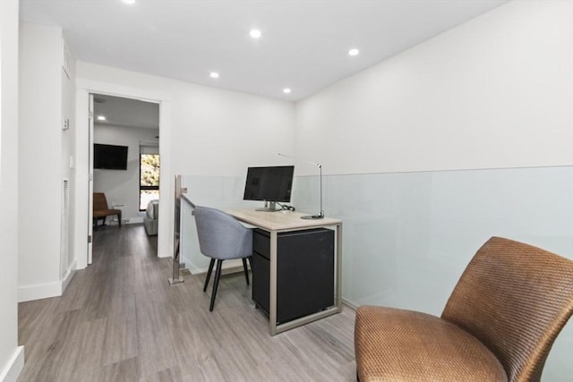 home office featuring light wood-style floors, baseboards, and recessed lighting