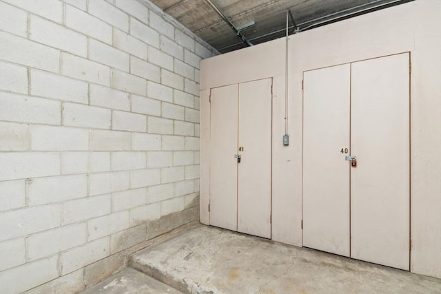interior space with concrete block wall