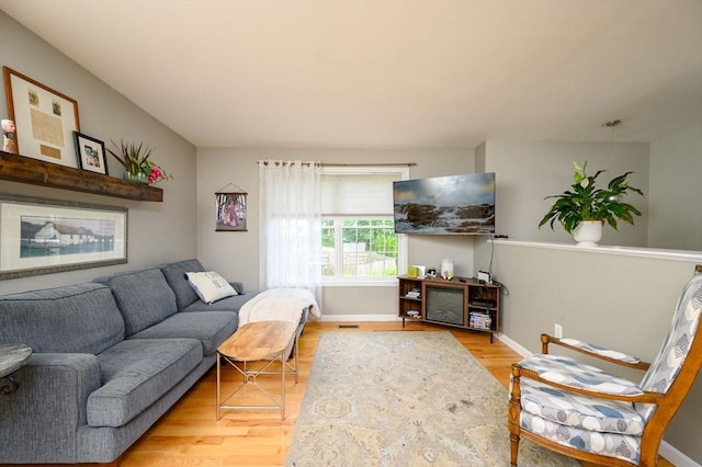 89 Block St, Abington, MA 02351 - living room with light wood-style floors and baseboards