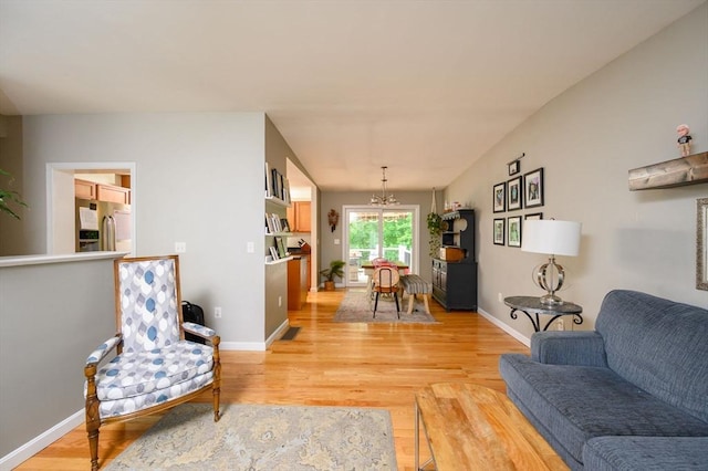 89 Block St, Abington, MA 02351 - living area with a chandelier, light wood-style flooring, and baseboards