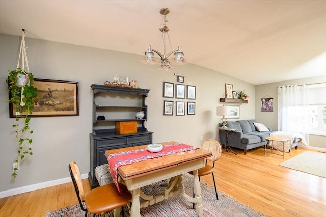 89 Block St, Abington, MA 02351 - dining space featuring a chandelier, light wood finished floors, baseboards, and vaulted ceiling