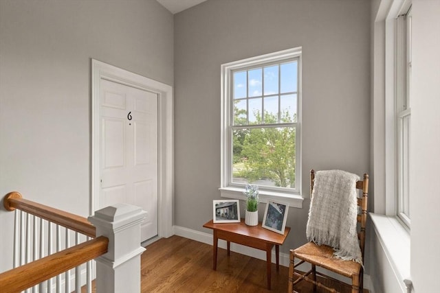 sitting room with hardwood / wood-style flooring