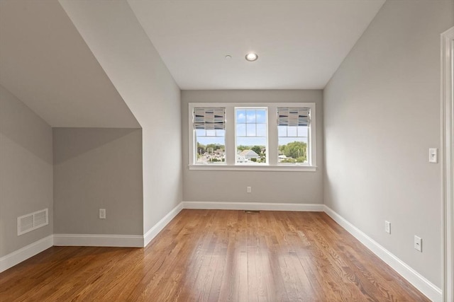 bonus room with light hardwood / wood-style floors