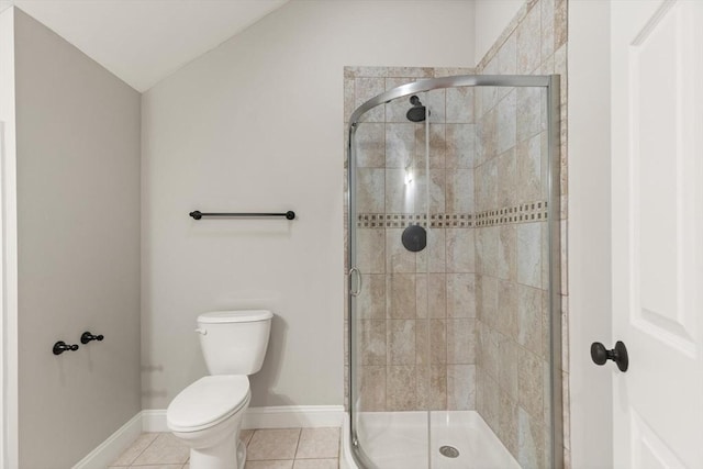 bathroom with toilet, an enclosed shower, vaulted ceiling, and tile patterned floors