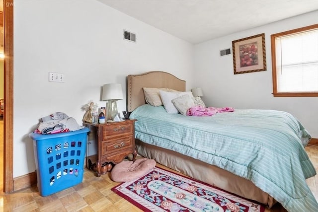 bedroom featuring visible vents