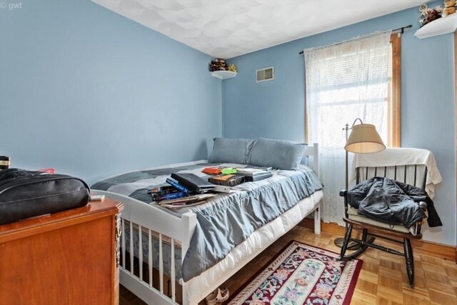 bedroom featuring visible vents