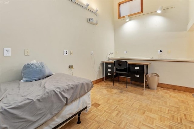 bedroom featuring baseboards