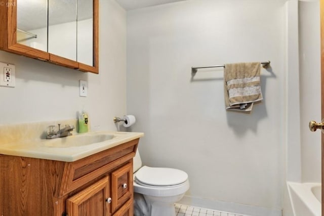 bathroom featuring a bath, vanity, toilet, walk in shower, and baseboards