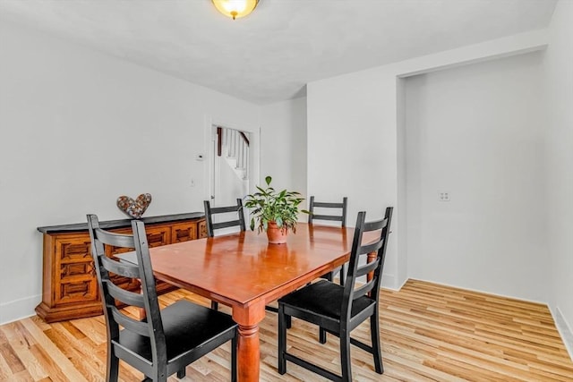 66 Guinan St, Waltham, MA 02451 - dining area featuring stairs and light wood-type flooring