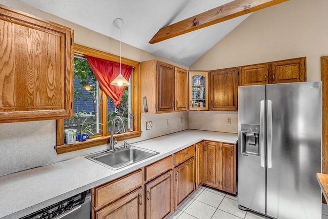 66 Guinan St, Waltham, MA 02451 - kitchen with appliances with stainless steel finishes, light countertops, brown cabinets, and hanging light fixtures