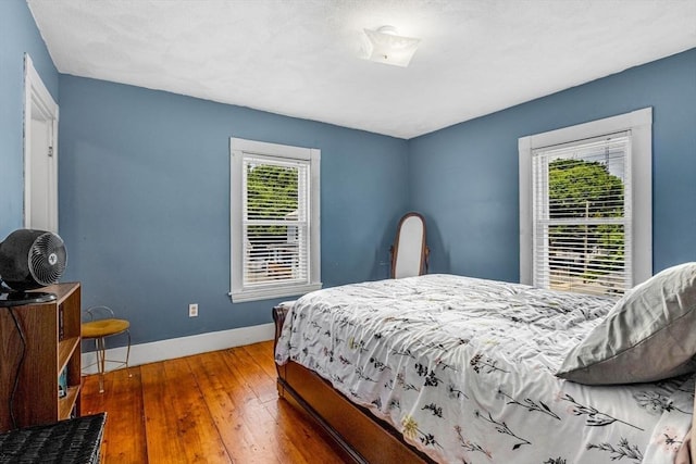 66 Guinan St, Waltham, MA 02451 - bedroom featuring hardwood / wood-style floors and baseboards