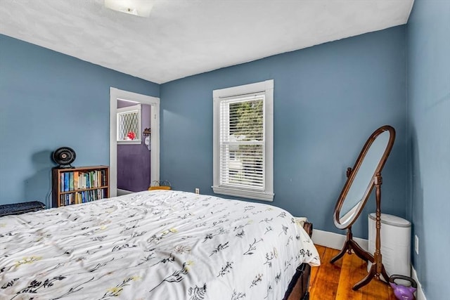 66 Guinan St, Waltham, MA 02451 - bedroom featuring dark wood-style floors and baseboards