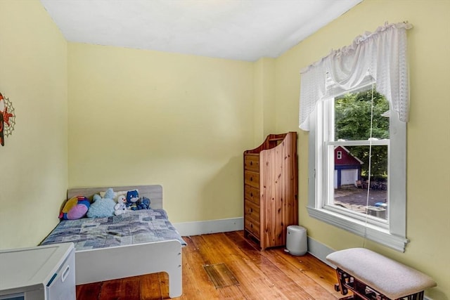 66 Guinan St, Waltham, MA 02451 - bedroom with light wood-style floors and baseboards