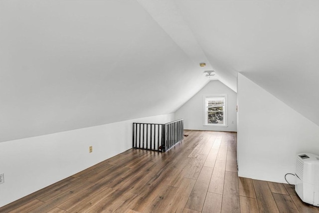 66 Guinan St, Waltham, MA 02451 - additional living space featuring vaulted ceiling and wood finished floors