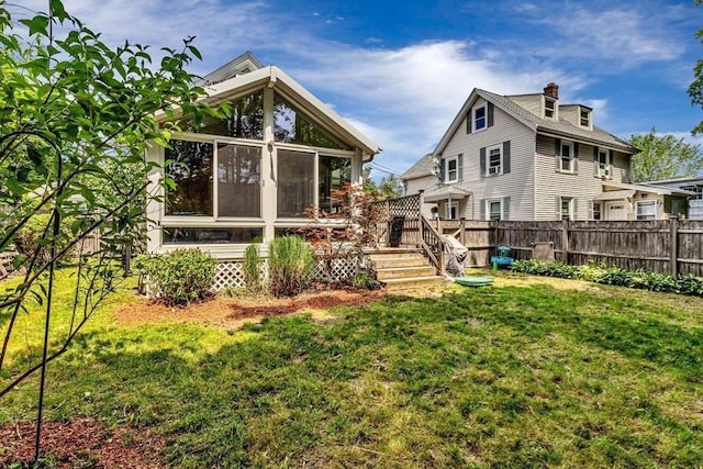 66 Guinan St, Waltham, MA 02451 - rear view of house featuring a sunroom and a chimney