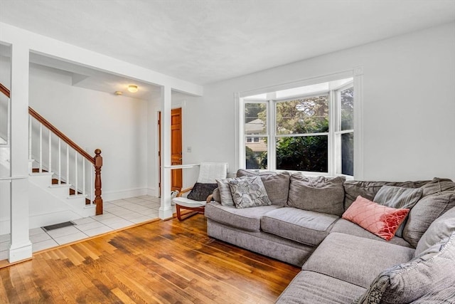 66 Guinan St, Waltham, MA 02451 - living room featuring stairs and light wood-type flooring