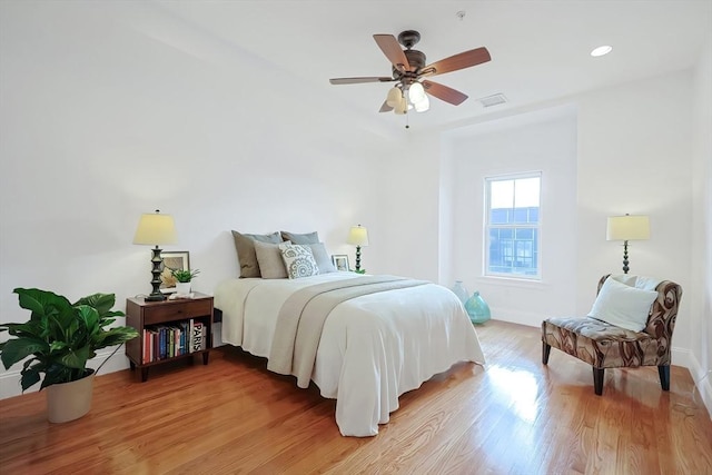 bedroom featuring recessed lighting, visible vents, light wood-style flooring, and baseboards