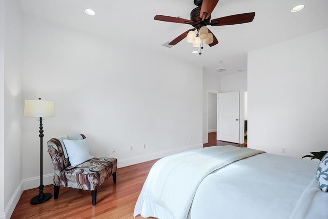 bedroom featuring recessed lighting, light wood-style flooring, visible vents, and baseboards