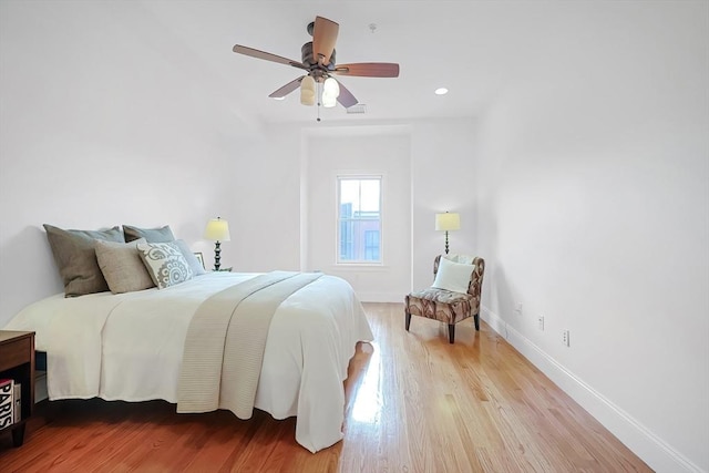 bedroom featuring visible vents, ceiling fan, baseboards, recessed lighting, and wood finished floors