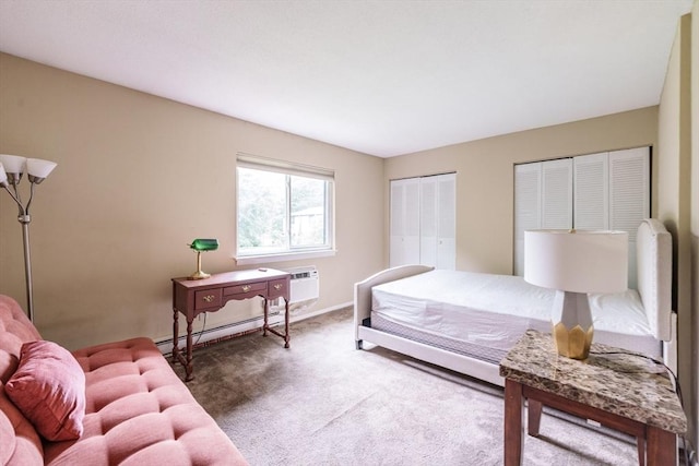 170 E Hadley Rd Unit 60, Amherst, MA 01002 - bedroom with a baseboard heating unit, carpet, and a wall unit AC