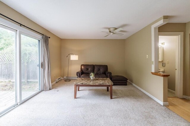 170 E Hadley Rd Unit 60, Amherst, MA 01002 - living area featuring a ceiling fan, light colored carpet, and baseboard heating