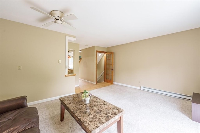 170 E Hadley Rd Unit 60, Amherst, MA 01002 - living area with baseboard heating, light carpet, stairs, and ceiling fan