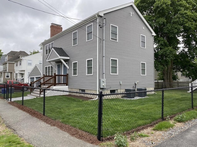 309 Farrington St, Quincy, MA 02170 - view of side of home featuring a chimney and central AC unit