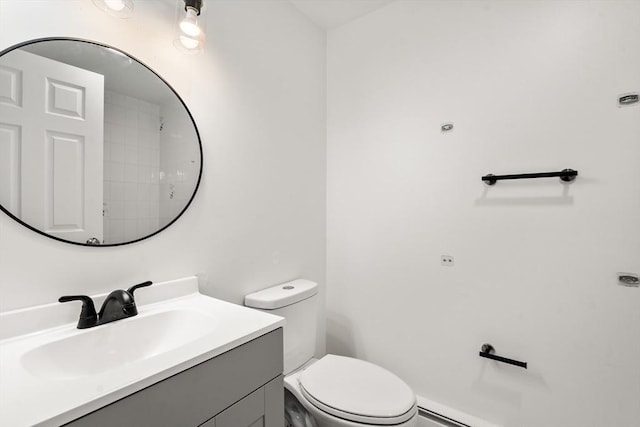 bathroom featuring toilet and vanity
