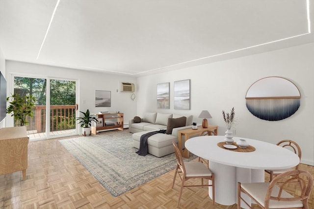 dining space featuring a baseboard radiator and a wall mounted air conditioner