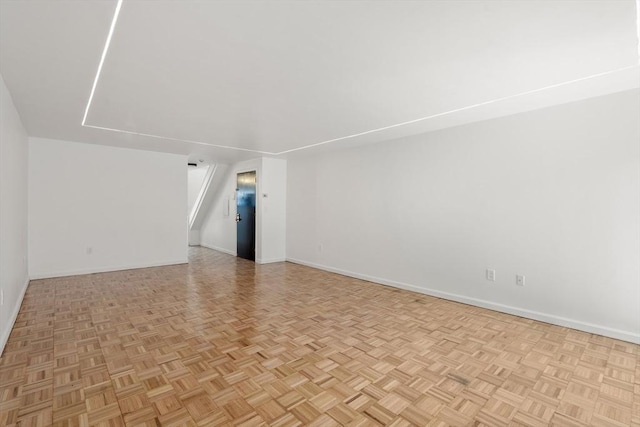 empty room with baseboards