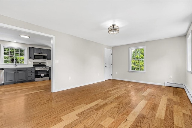 69 Biscuit Hill Dr, Leominster, MA 01453 - empty room with light wood-style flooring and healthy amount of natural light
