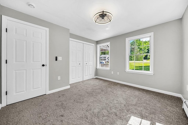 69 Biscuit Hill Dr, Leominster, MA 01453 - unfurnished bedroom featuring carpet floors, a closet, and baseboard heating