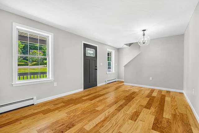 69 Biscuit Hill Dr, Leominster, MA 01453 - entryway with a baseboard heating unit, light wood-type flooring, and plenty of natural light