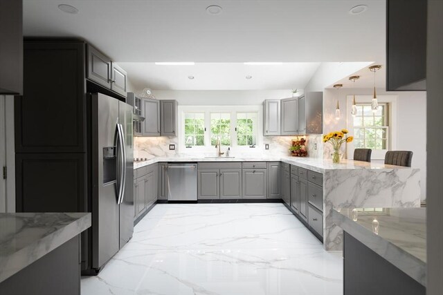 338 Highland St, Weston, MA 02493 - kitchen with appliances with stainless steel finishes, gray cabinets, decorative backsplash, light stone countertops, and recessed lighting