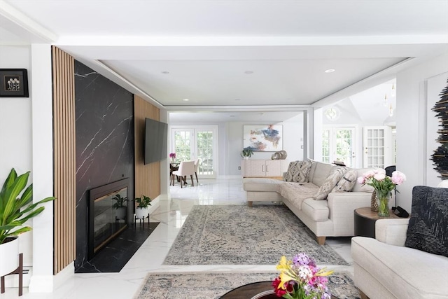 338 Highland St, Weston, MA 02493 - living area with marble tiled floors, a premium fireplace, plenty of natural light, recessed lighting, and baseboards