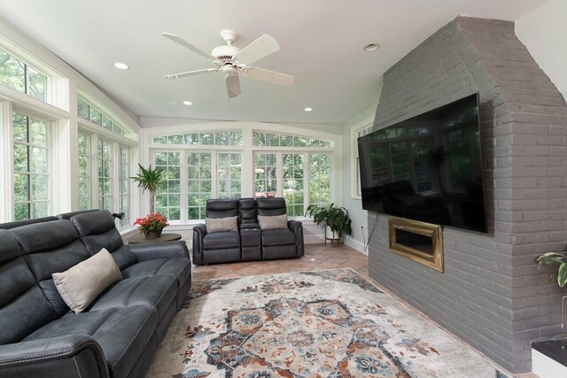 338 Highland St, Weston, MA 02493 - tiled living area with ceiling fan, recessed lighting, a glass covered fireplace, and baseboards