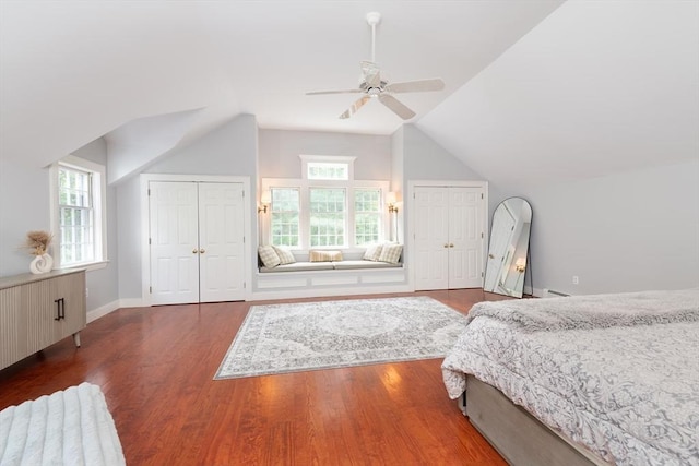 338 Highland St, Weston, MA 02493 - bedroom with multiple closets, lofted ceiling, wood finished floors, multiple windows, and a ceiling fan