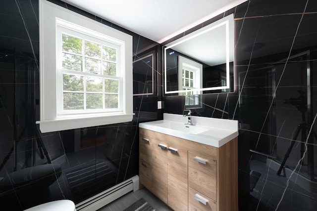 338 Highland St, Weston, MA 02493 - full bathroom with tile walls, a baseboard heating unit, vanity, a shower stall, and toilet