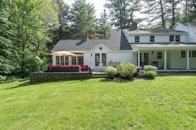 338 Highland St, Weston, MA 02493 - back of house featuring french doors, an outdoor hangout area, a yard, and a chimney