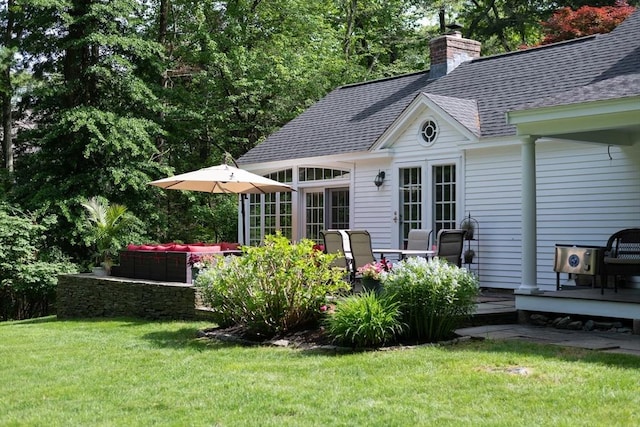 338 Highland St, Weston, MA 02493 - rear view of property with a shingled roof, a yard, a chimney, and a wooden deck