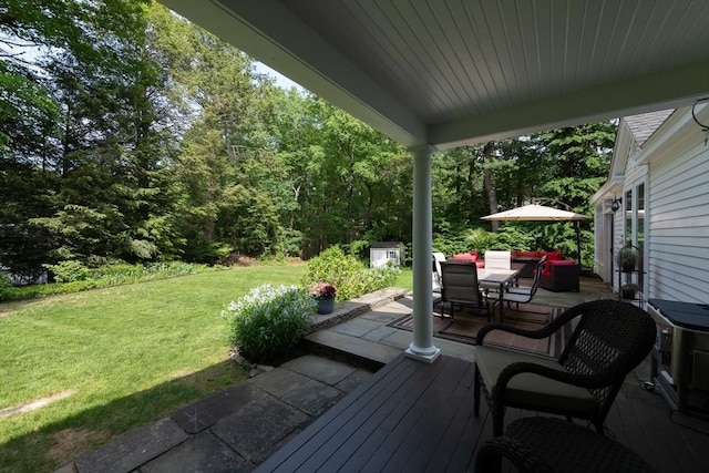 338 Highland St, Weston, MA 02493 - wooden deck featuring outdoor dining space, a lawn, and a forest view