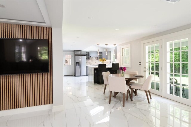 338 Highland St, Weston, MA 02493 - dining space featuring healthy amount of natural light, light marble finish floors, baseboards, and recessed lighting