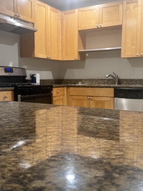 486 Revere Unit 2, Revere, MA 02151 - kitchen with appliances with stainless steel finishes, under cabinet range hood, open shelves, and dark stone countertops