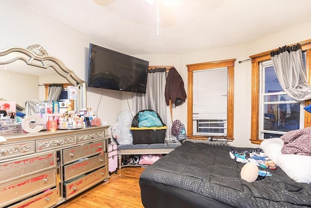 bedroom with ceiling fan and light hardwood / wood-style flooring