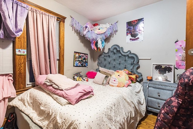 bedroom with wood-type flooring