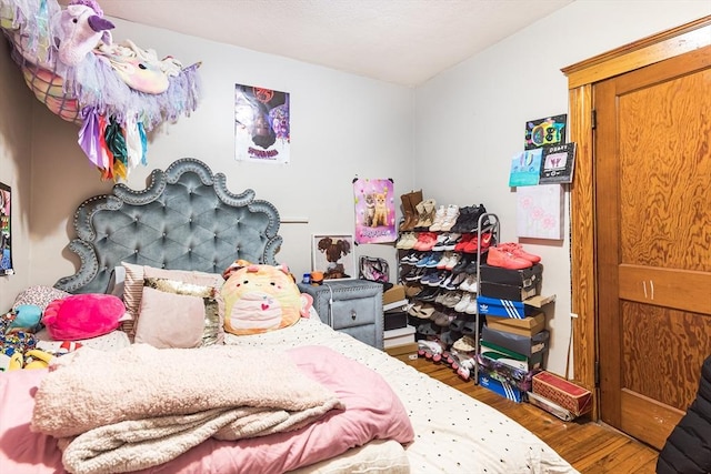 bedroom featuring hardwood / wood-style flooring