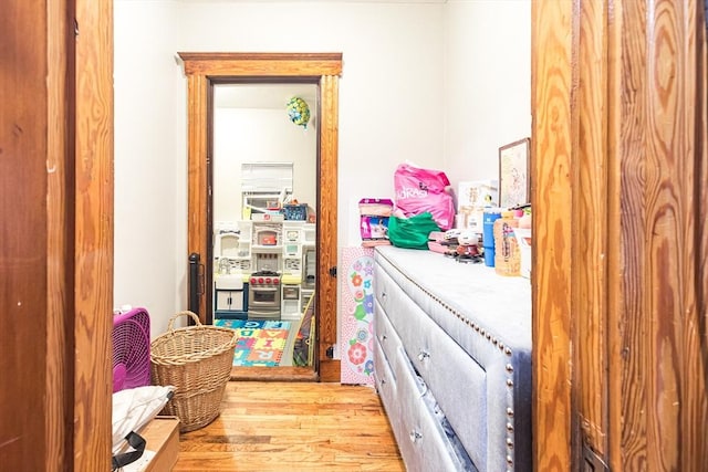 hallway with light hardwood / wood-style flooring