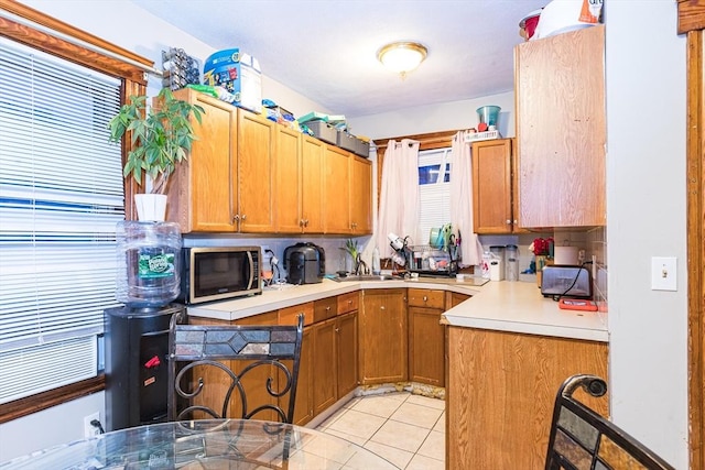 kitchen with sink and light tile patterned floors