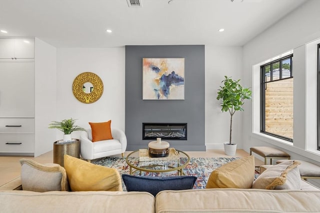 145 Warren St Unit 5, Newton, MA 02459 - living room with recessed lighting and a glass covered fireplace